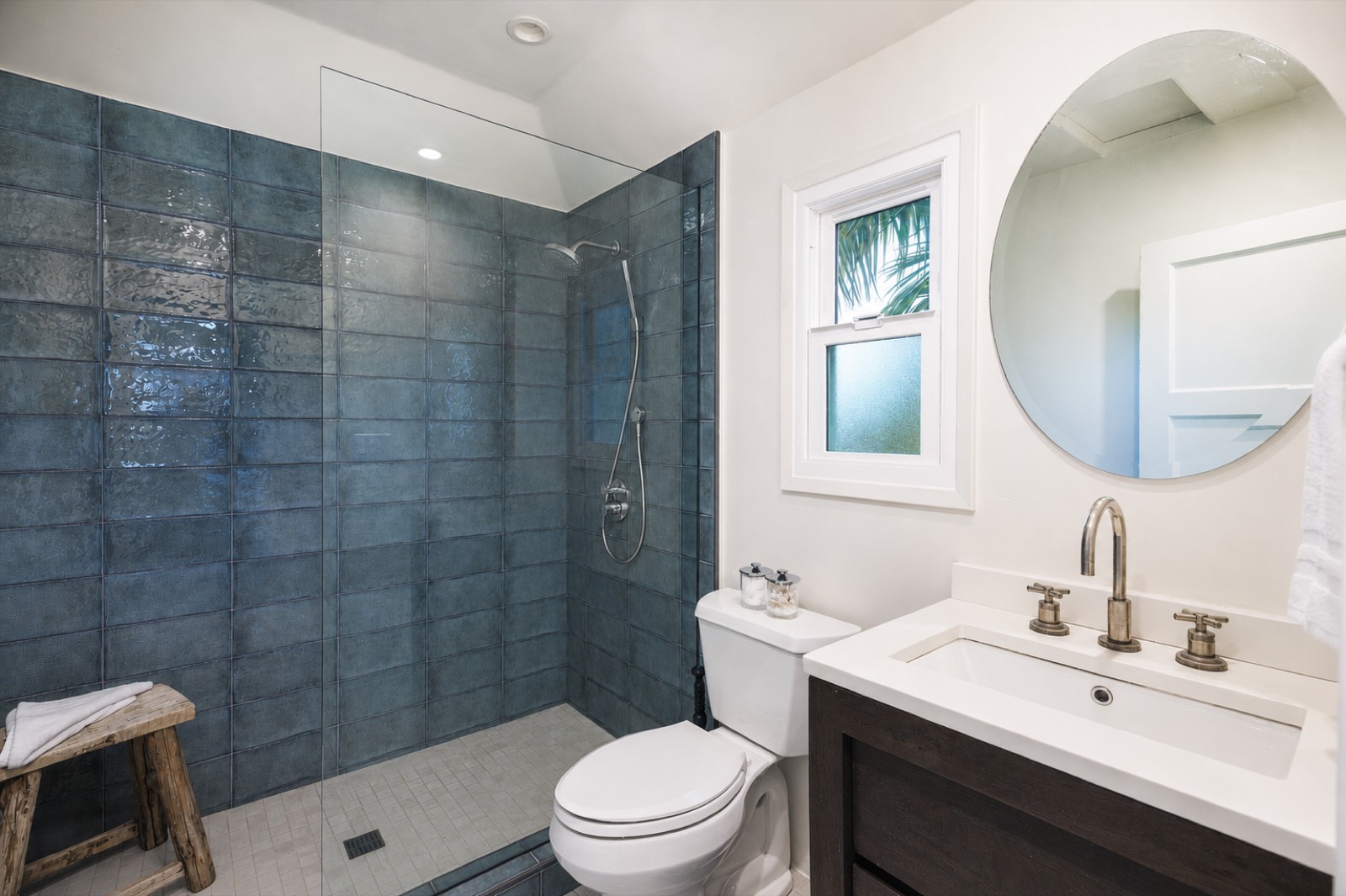 Bathroom with blue tiled shower